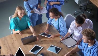 Healthcare professionals looking at continuing education programs